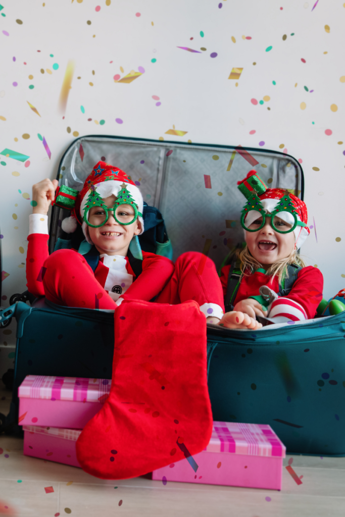 Holiday travel kids in suitcase